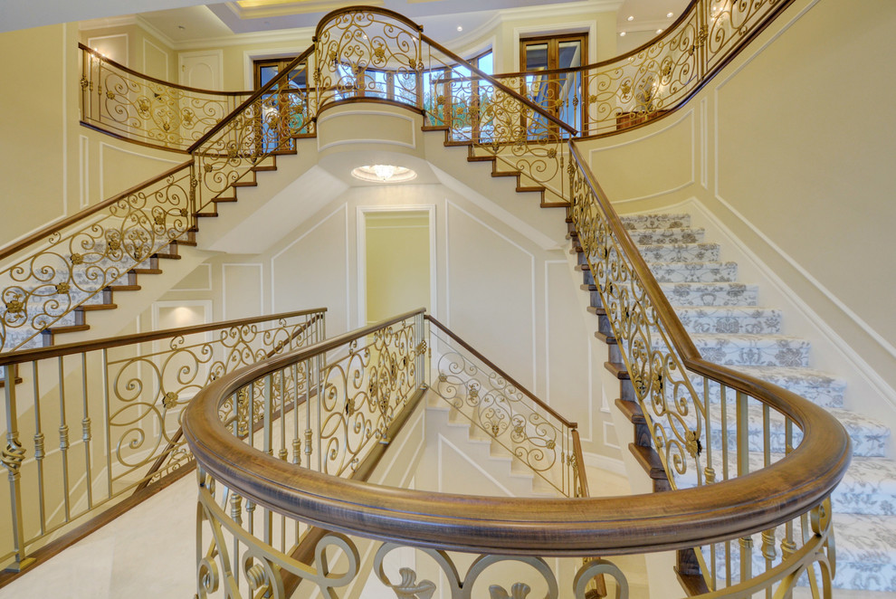Inspiration for an expansive mediterranean carpeted staircase in Vancouver with carpet risers and mixed railing.
