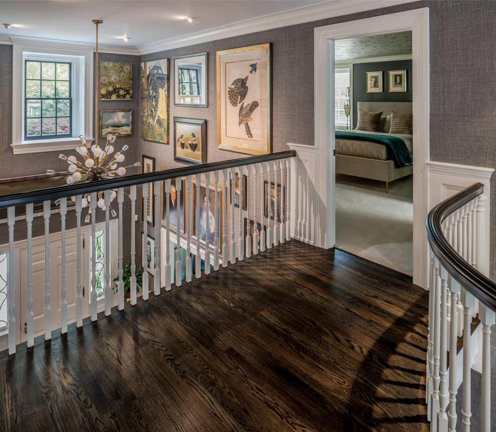 Inspiration for a large traditional wood floating staircase in Wilmington with wood risers and wood railing.