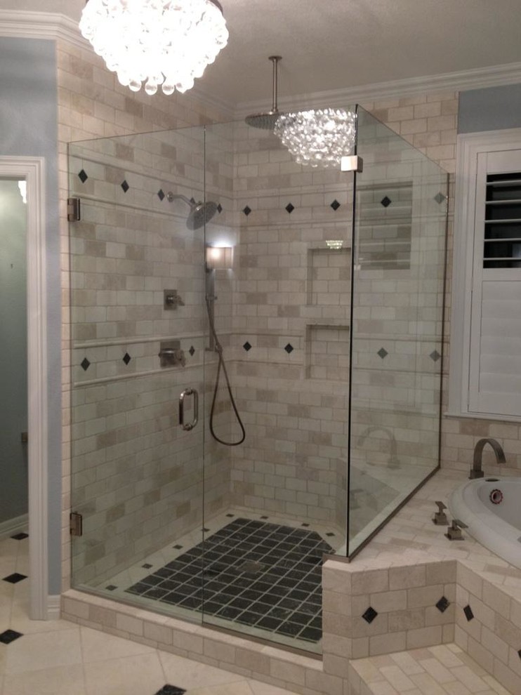 Large traditional master bathroom in Denver with a drop-in sink, raised-panel cabinets, black cabinets, quartzite benchtops, a drop-in tub, a corner shower, beige tile, stone tile, blue walls and marble floors.