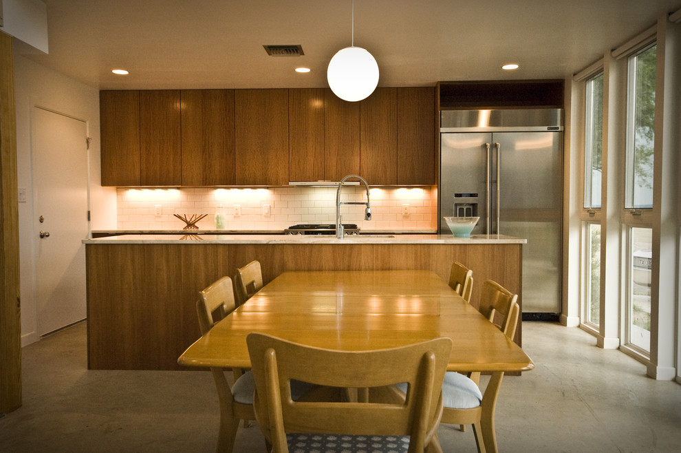 Photo of a modern kitchen in Austin with subway tile splashback.