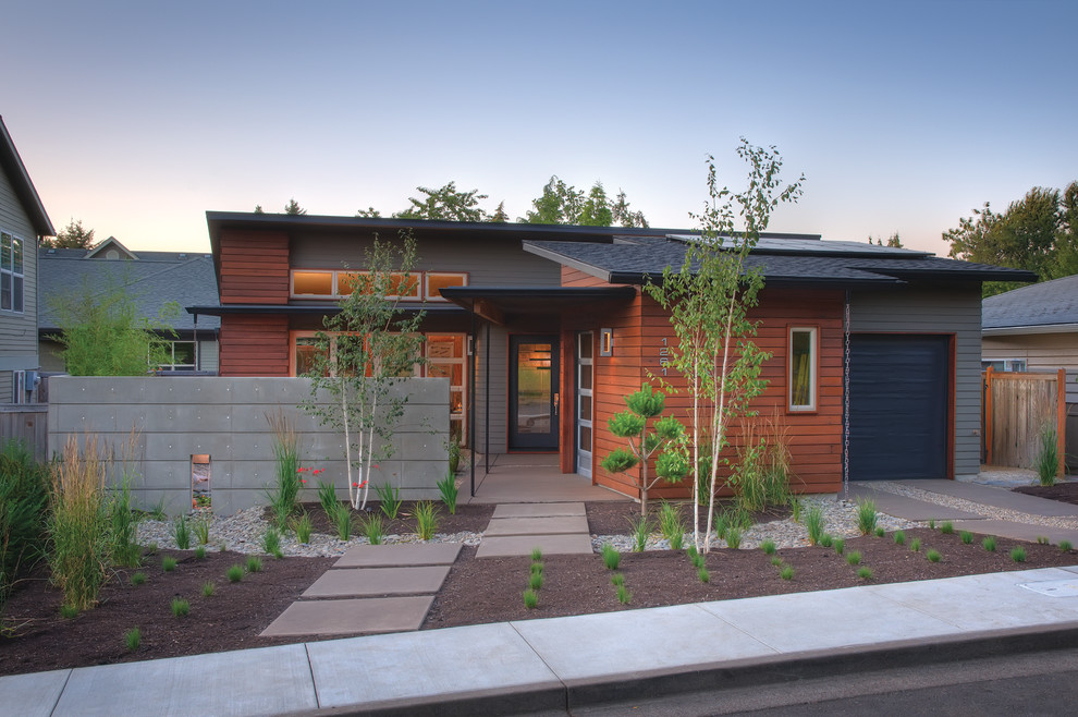 Inspiration for a small transitional gray one-story mixed siding house exterior remodel with a shed roof and a shingle roof