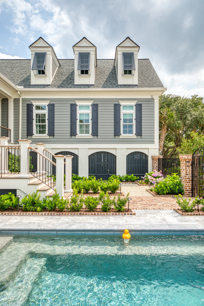 Beach style pool photo in Charleston