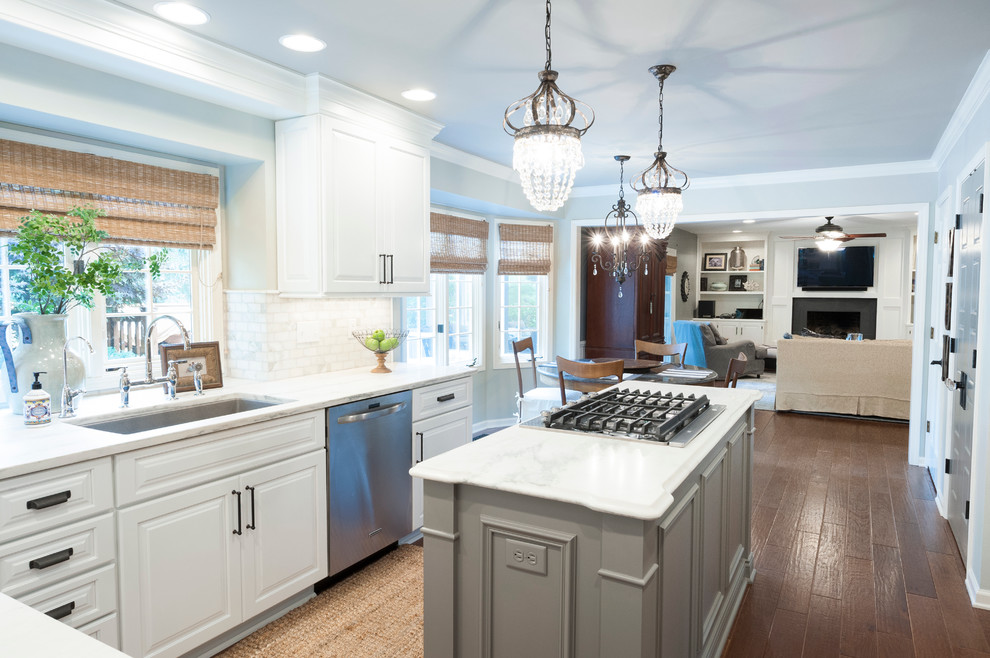 Eat-in kitchen - mid-sized transitional l-shaped dark wood floor eat-in kitchen idea in Indianapolis with a single-bowl sink, raised-panel cabinets, white cabinets, marble countertops, gray backsplash, stainless steel appliances and an island