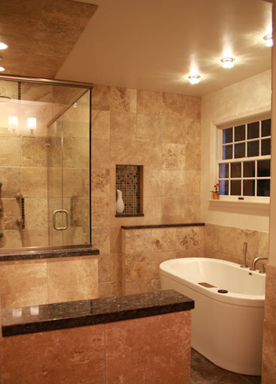 This is an example of a large transitional master bathroom in Philadelphia with a freestanding tub, a corner shower, beige tile, ceramic tile, beige walls, ceramic floors, beige floor and a hinged shower door.