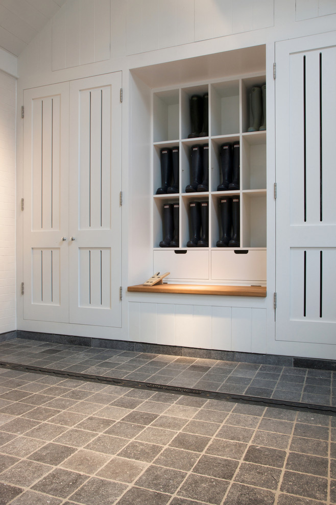 Photo of a modern laundry room in Wiltshire with limestone floors.