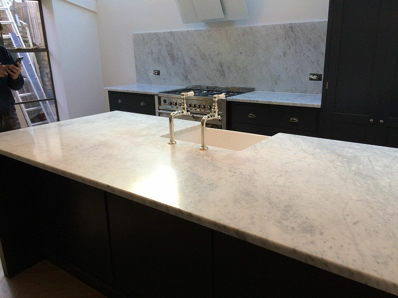 Photo of a country kitchen in London with marble worktops and white worktops.