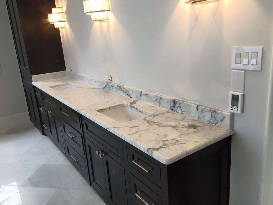 Inspiration for a mid-sized transitional master ceramic tile bathroom remodel in Dallas with recessed-panel cabinets, black cabinets, white walls, an undermount sink and marble countertops