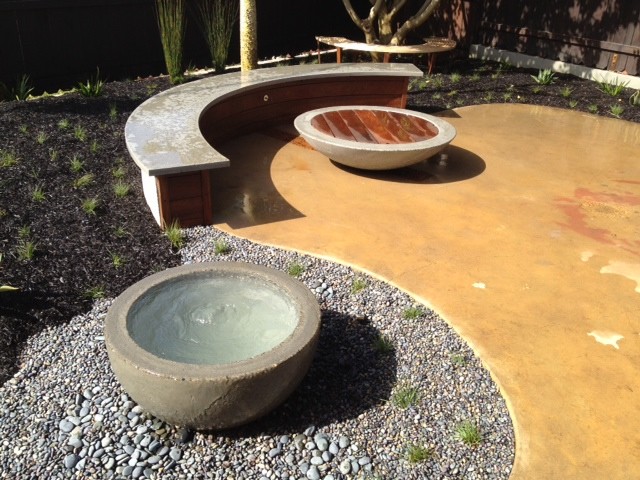 Mid-sized modern backyard patio in San Luis Obispo with a water feature, concrete slab and no cover.