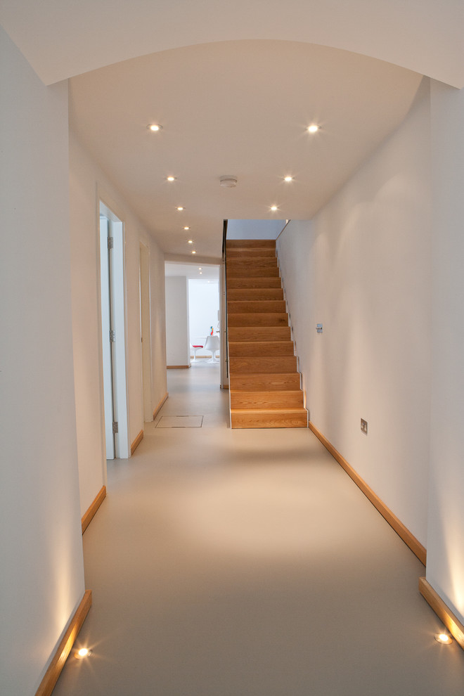 Design ideas for a modern hallway in London with white walls.