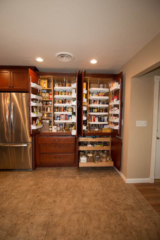 Kitchen - large transitional u-shaped porcelain tile kitchen idea with an undermount sink, flat-panel cabinets, medium tone wood cabinets, quartz countertops, beige backsplash, mosaic tile backsplash, stainless steel appliances and an island