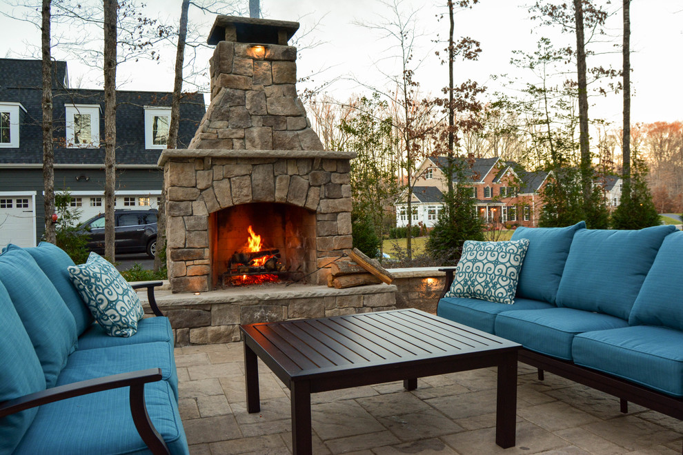 Photo of a mid-sized traditional backyard patio in Richmond with a fire feature, concrete pavers and no cover.