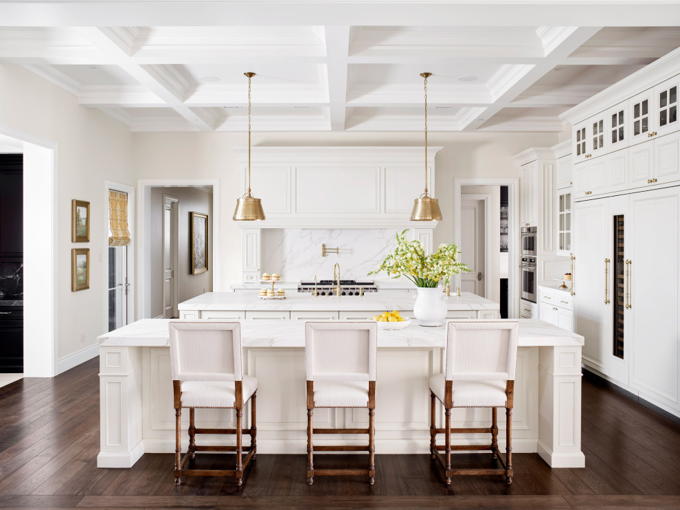 Design ideas for a mediterranean u-shaped eat-in kitchen in Phoenix with a farmhouse sink, recessed-panel cabinets, white cabinets, multi-coloured splashback, panelled appliances, medium hardwood floors, multiple islands, brown floor, multi-coloured benchtop and coffered.