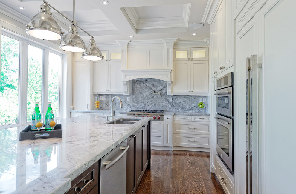 Example of a large transitional l-shaped medium tone wood floor eat-in kitchen design in Toronto with a double-bowl sink, flat-panel cabinets, white cabinets, wood countertops, gray backsplash, stone tile backsplash, stainless steel appliances and an island