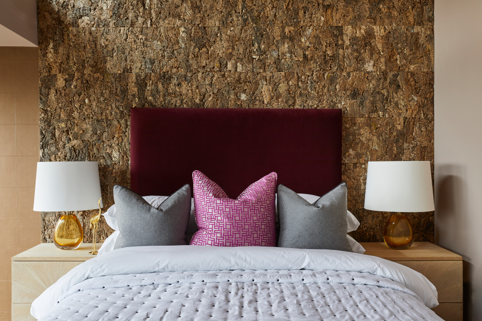 Urban guest bedroom photo in London with brown walls