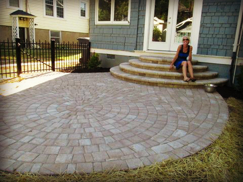 Patio - large rustic backyard concrete paver patio idea with no cover and a fire pit