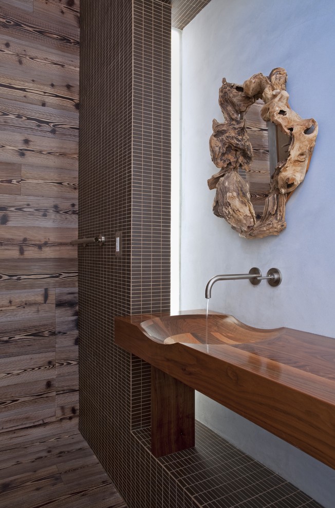 Contemporary bathroom in San Diego with an integrated sink, wood benchtops, brown tile and brown benchtops.