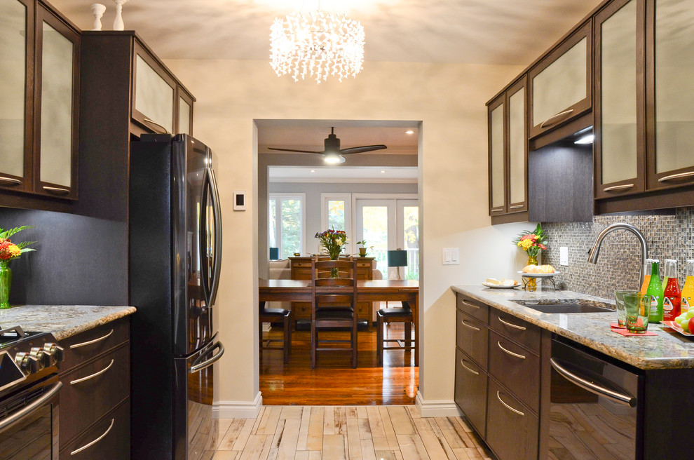 Kitchen - mid-sized transitional galley porcelain tile kitchen idea in Ottawa with an undermount sink, glass-front cabinets, brown cabinets, quartz countertops, brown backsplash, glass sheet backsplash and stainless steel appliances