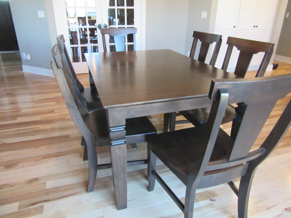 Example of a transitional light wood floor dining room design