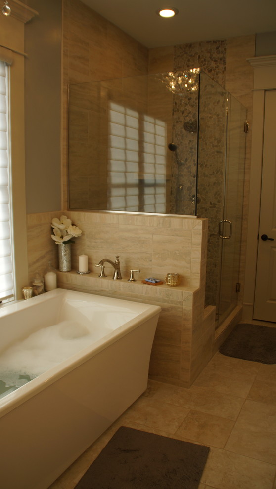 Design ideas for a mid-sized transitional master bathroom in Kansas City with recessed-panel cabinets, white cabinets, a freestanding tub, a corner shower, a one-piece toilet, multi-coloured tile, pebble tile, blue walls, travertine floors, an undermount sink and granite benchtops.