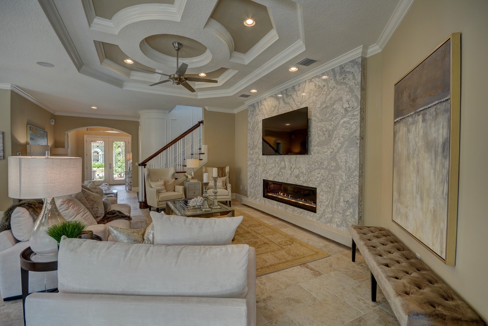 Photo of a large transitional formal open concept living room in Orlando with beige walls, ceramic floors, a ribbon fireplace, a wall-mounted tv, beige floor and a stone fireplace surround.