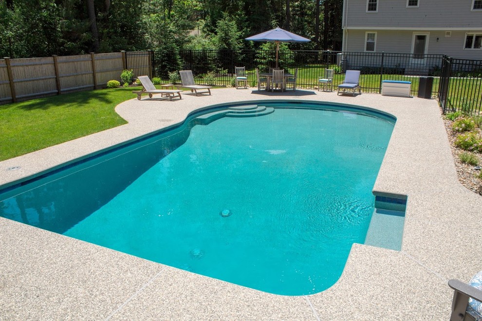 Mid-sized transitional backyard custom-shaped and decomposed granite lap pool photo in Boston