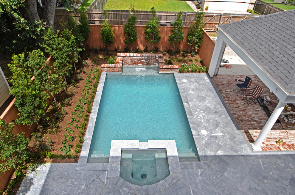 Design ideas for a mid-sized traditional backyard rectangular lap pool in New Orleans with a hot tub and tile.