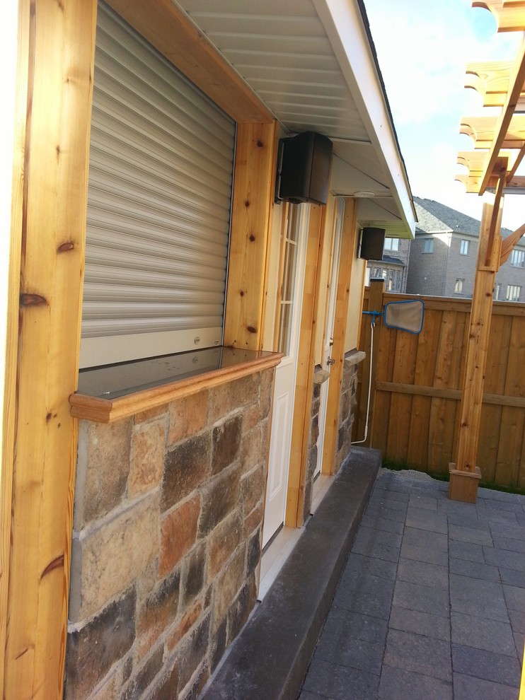 Example of a mountain style home design design in Toronto