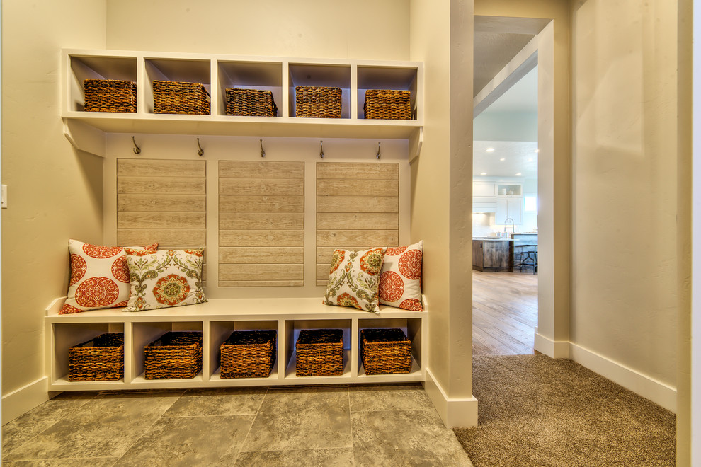 Inspiration for a mid-sized transitional mudroom in Boise with beige walls, ceramic floors and grey floor.
