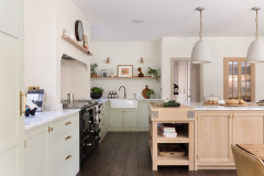 Pale Green and Oak Kitchen With a Hidden Pantry