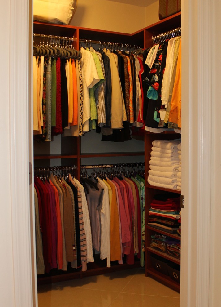 This is an example of a mid-sized traditional men's walk-in wardrobe in Phoenix with porcelain floors.