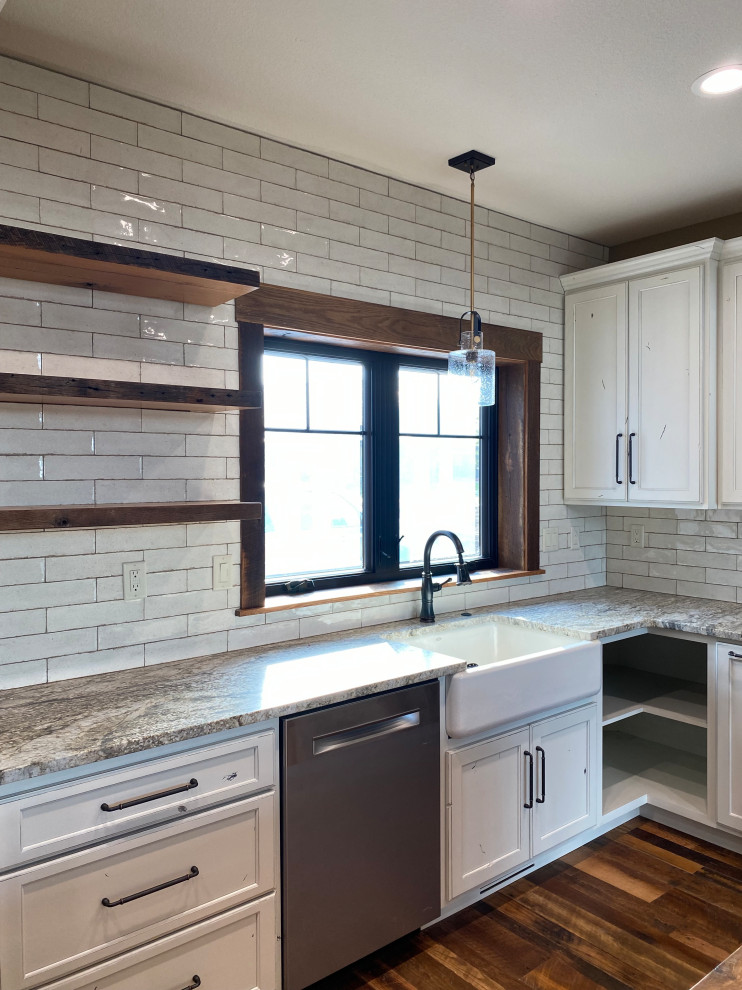 Mid-sized mountain style l-shaped medium tone wood floor and brown floor open concept kitchen photo in Kansas City with a farmhouse sink, shaker cabinets, dark wood cabinets, wood countertops, white backsplash, shiplap backsplash, stainless steel appliances, an island and brown countertops