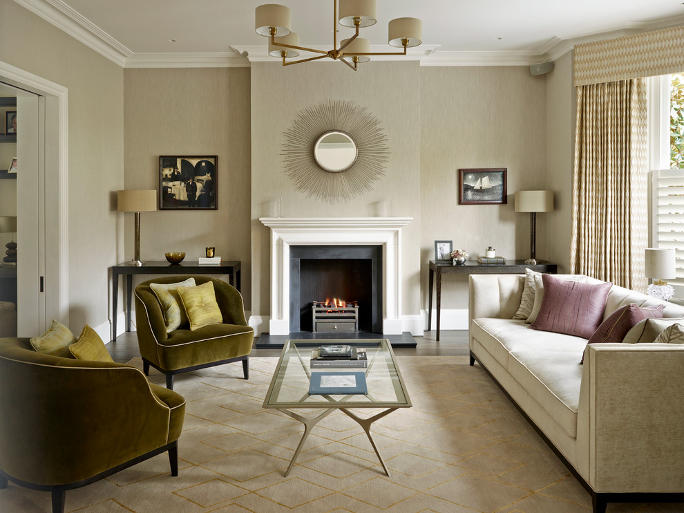 Photo of a mid-sized transitional formal enclosed living room in London with beige walls, dark hardwood floors, a standard fireplace, no tv and a plaster fireplace surround.