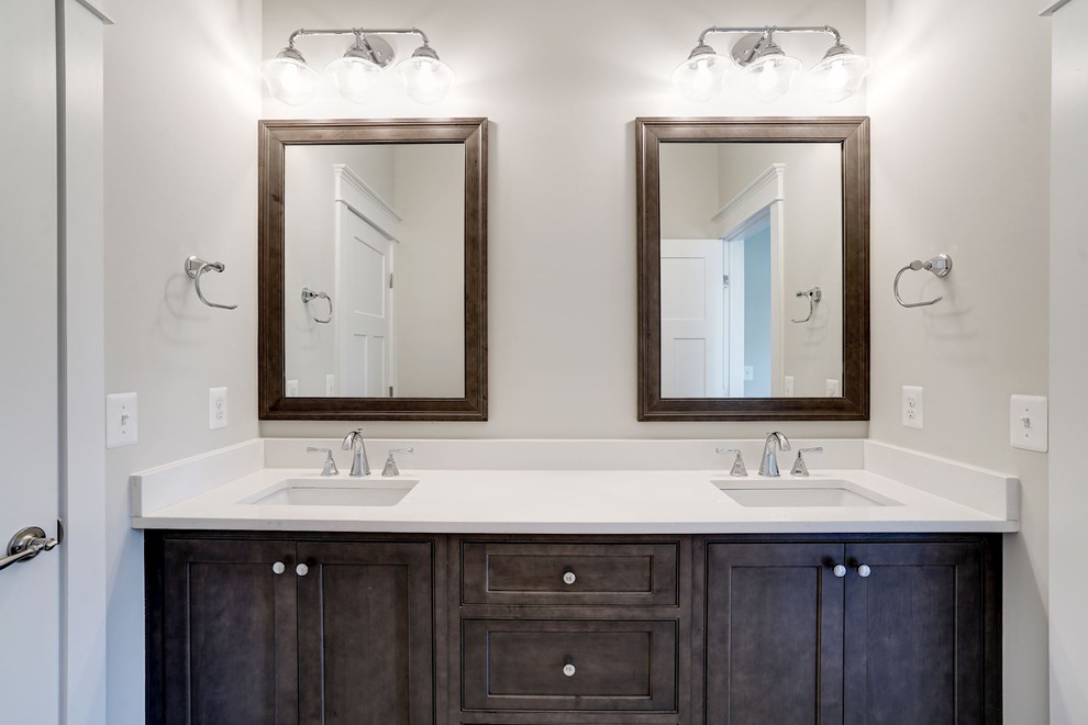 Inspiration for a mid-sized transitional kids bathroom in DC Metro with beaded inset cabinets, dark wood cabinets, brown walls, an undermount sink and engineered quartz benchtops.