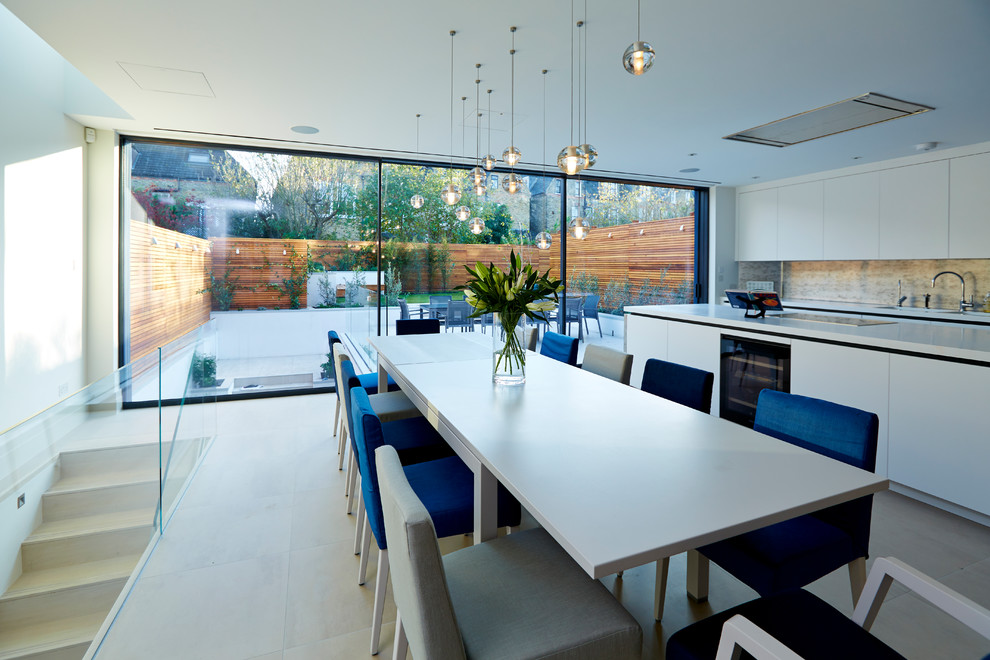 Inspiration for a large contemporary kitchen/dining combo in London with ceramic floors.