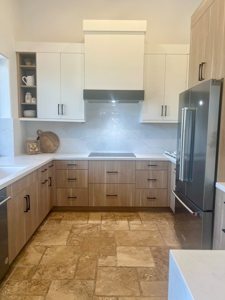 Inspiration for a small transitional u-shaped travertine floor, beige floor and vaulted ceiling eat-in kitchen remodel in Phoenix with a drop-in sink, flat-panel cabinets, quartz countertops, white backsplash, quartz backsplash, stainless steel appliances, an island and white countertops