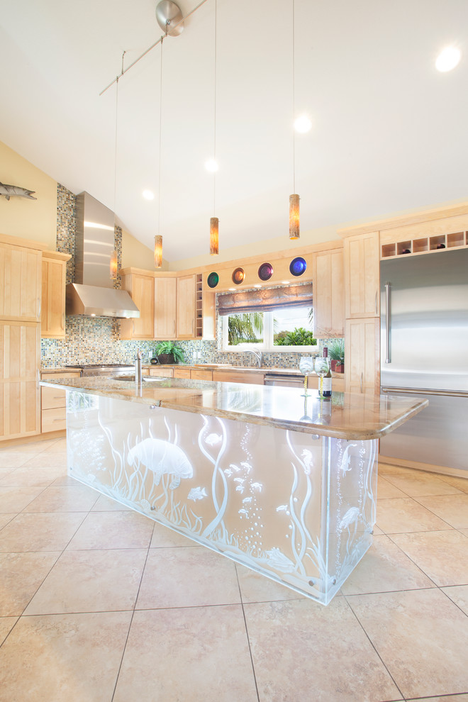Large tropical l-shaped kitchen in Miami with light wood cabinets, granite benchtops, multi-coloured splashback, mosaic tile splashback, stainless steel appliances, porcelain floors, with island, shaker cabinets and beige floor.