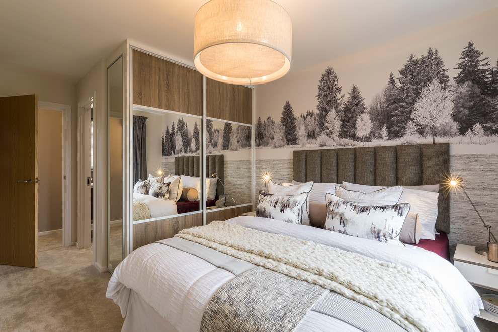 This is an example of a scandinavian bedroom in Manchester with beige walls, carpet and beige floor.