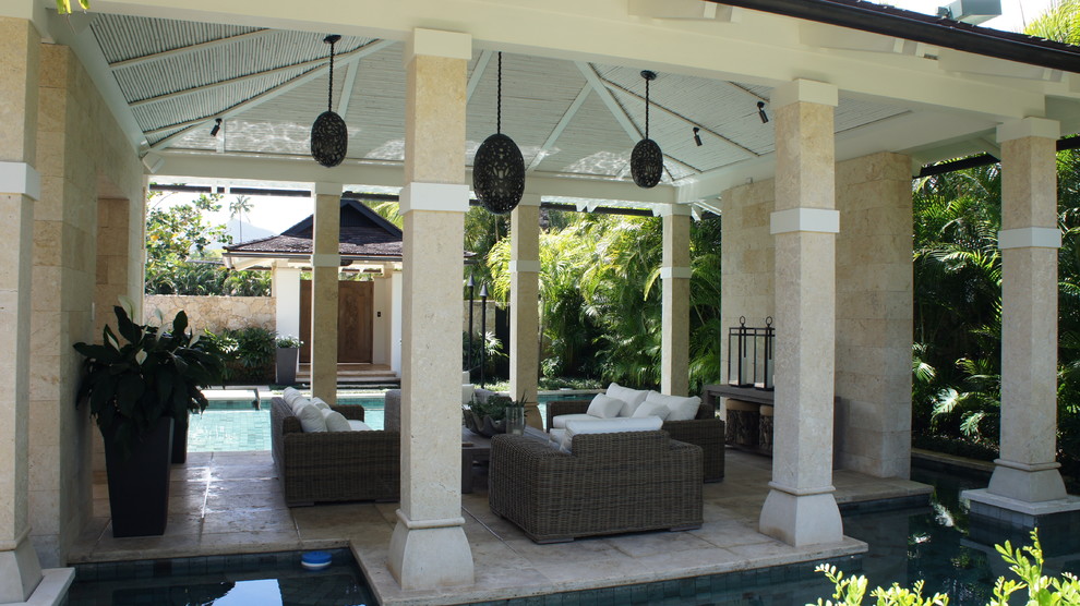 Design ideas for an expansive tropical backyard patio in Hawaii with an outdoor kitchen, tile and a gazebo/cabana.