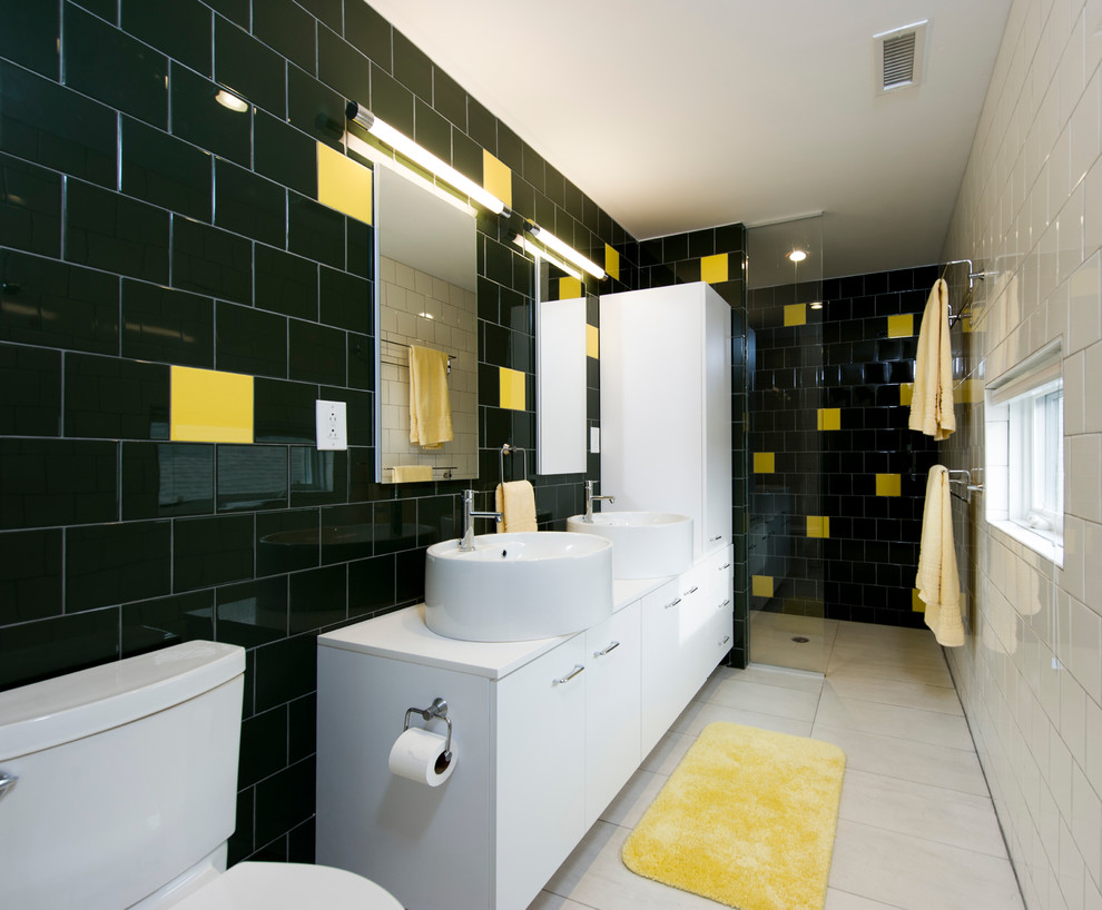 This is an example of a contemporary bathroom in DC Metro with a vessel sink, flat-panel cabinets, white cabinets, an open shower, black tile, black walls and an open shower.