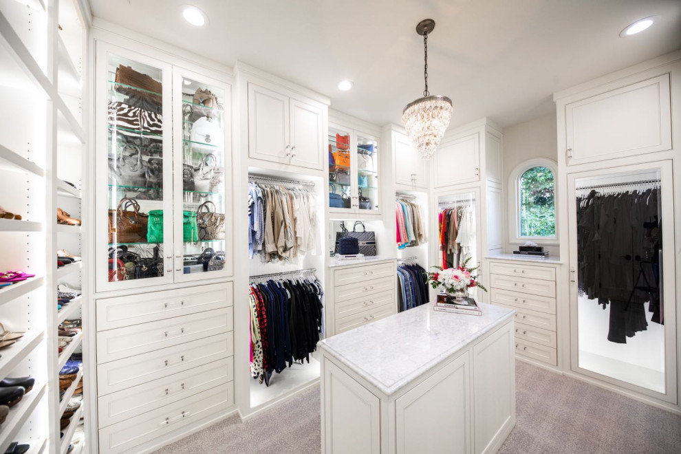 Photo of a large traditional women's walk-in wardrobe in Dallas with beaded inset cabinets, white cabinets, carpet and grey floor.