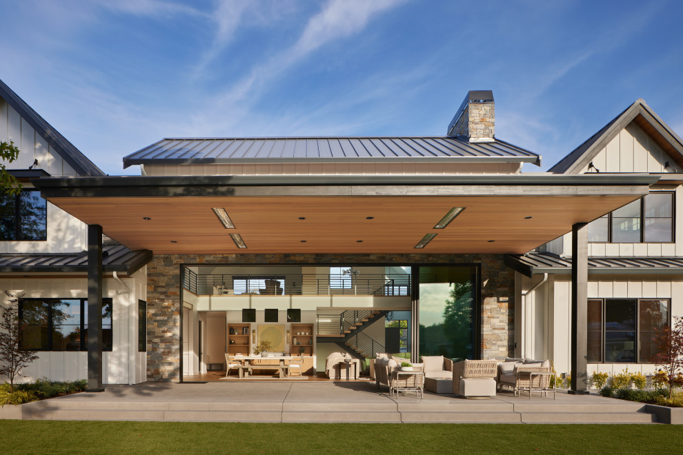 Inspiration for a country patio in Seattle with concrete slab and a roof extension.
