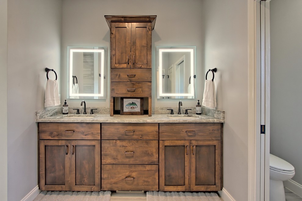 Inspiration for a large arts and crafts master bathroom in Atlanta with shaker cabinets, medium wood cabinets, an alcove tub, a curbless shower, a two-piece toilet, grey walls, ceramic floors, an undermount sink, granite benchtops, grey floor and multi-coloured benchtops.