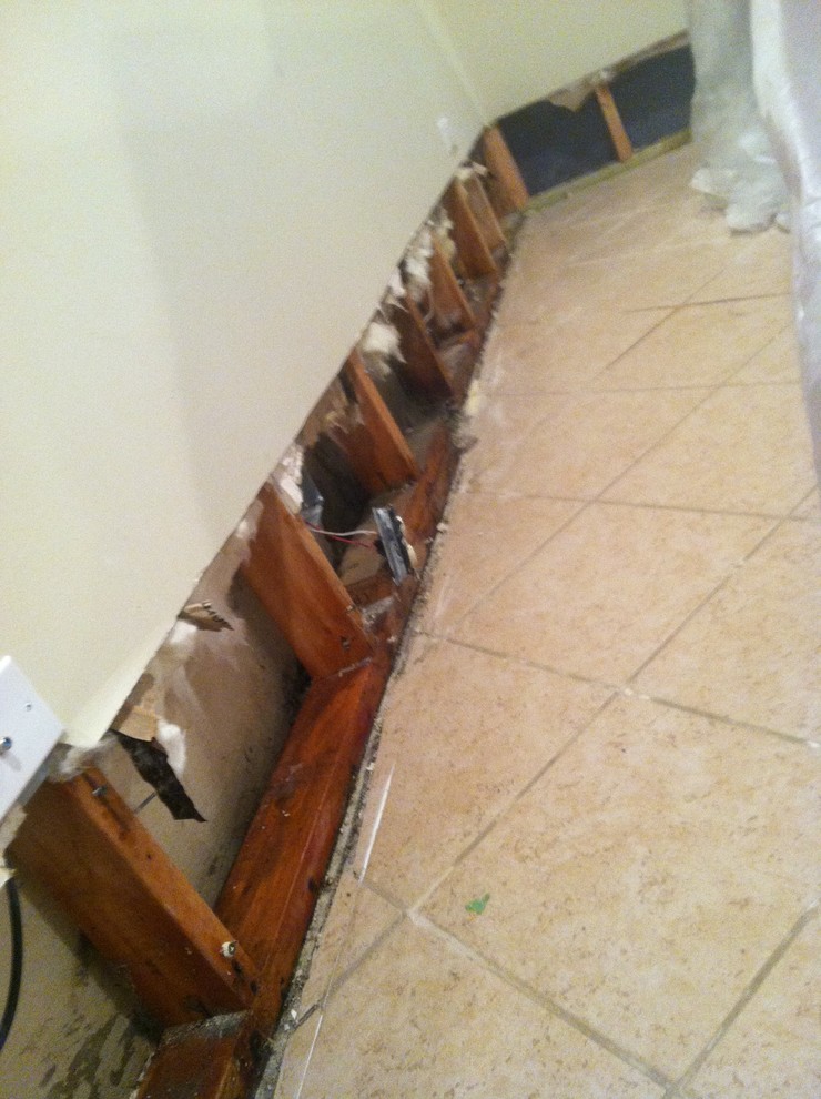 Tile or drywall for replacing the lower half of a wall after a flood?