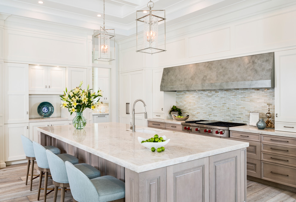 Inspiration for a transitional light wood floor open concept kitchen remodel with stainless steel appliances and an island