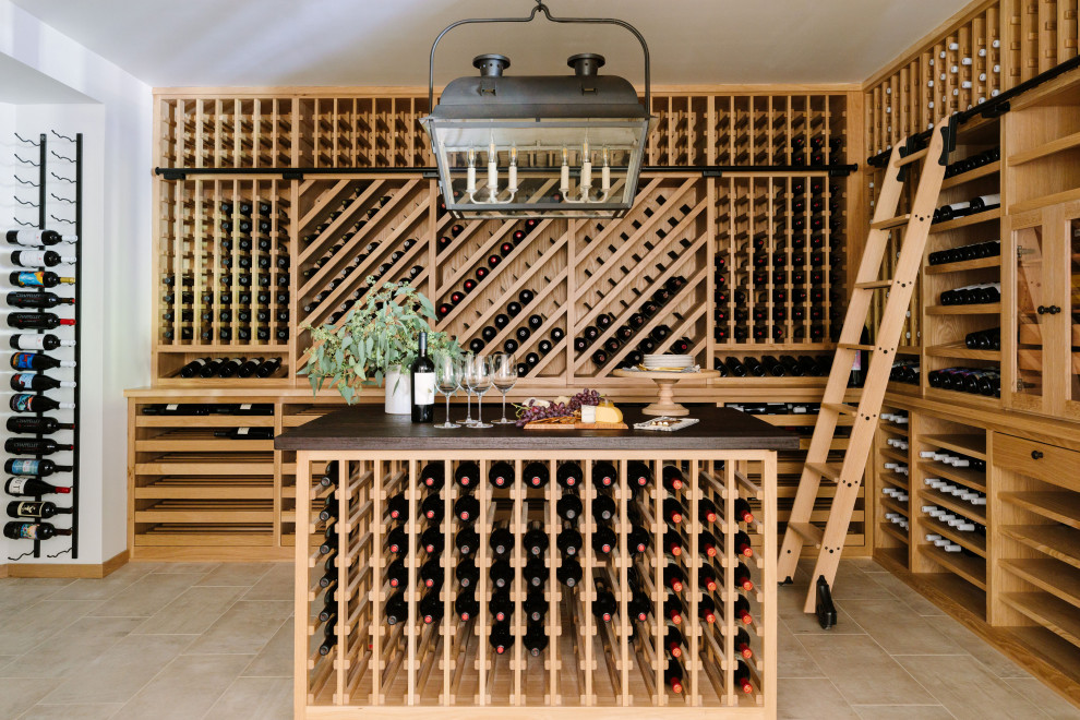 Design ideas for a traditional wine cellar in Kansas City with storage racks and beige floor.