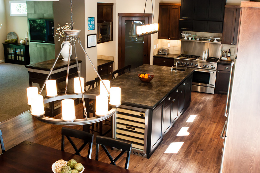 Mid-sized transitional l-shaped dark wood floor and brown floor eat-in kitchen photo in San Diego with an undermount sink, shaker cabinets, dark wood cabinets, marble countertops, beige backsplash, ceramic backsplash, stainless steel appliances, an island and brown countertops