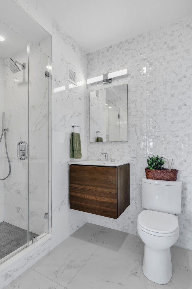 Design ideas for a contemporary 3/4 bathroom in New York with flat-panel cabinets, dark wood cabinets, an alcove shower, white tile, mosaic tile, an integrated sink, grey floor, a hinged shower door, white benchtops, a single vanity and a floating vanity.