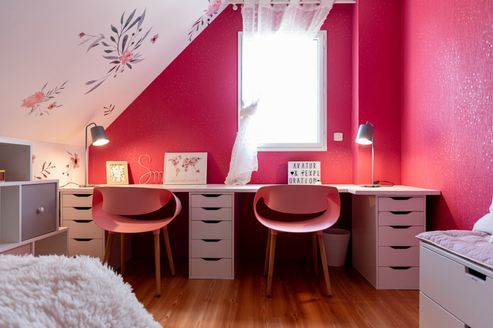 Design ideas for a mid-sized contemporary kids' bedroom for kids 4-10 years old and girls in Other with pink walls and light hardwood floors.