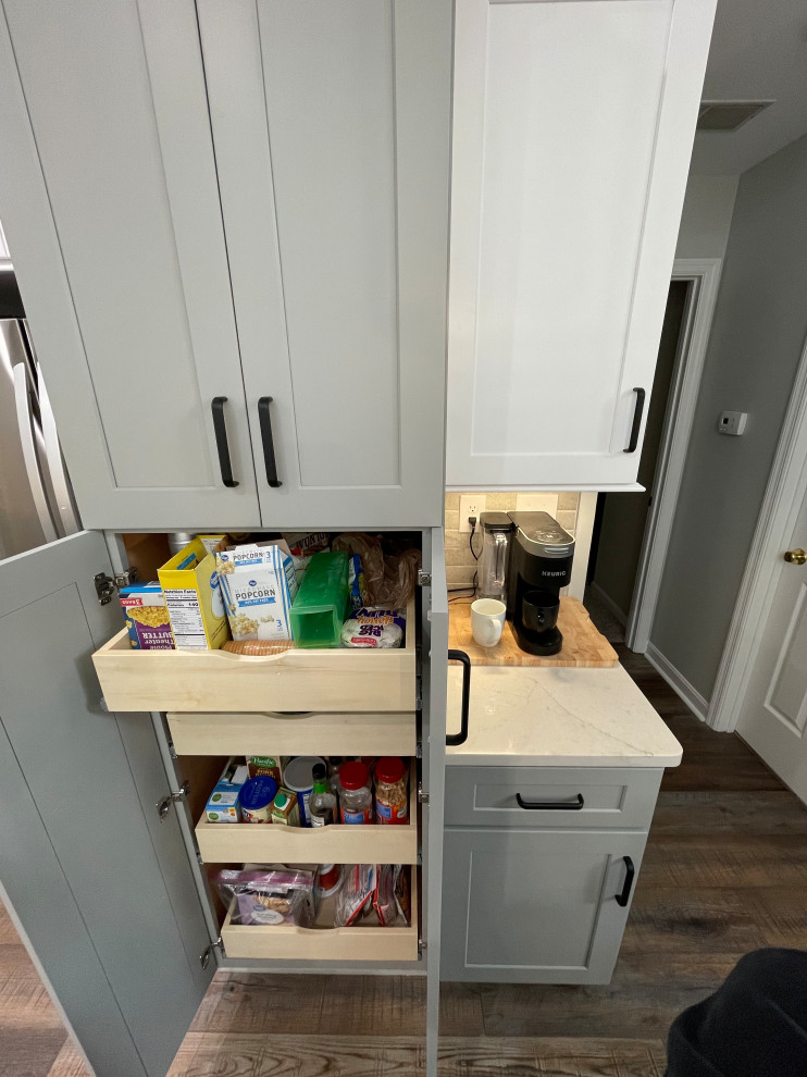 Small transitional single-wall vinyl floor and brown floor kitchen pantry photo with shaker cabinets, gray cabinets, quartz countertops, gray backsplash, subway tile backsplash, no island and white countertops