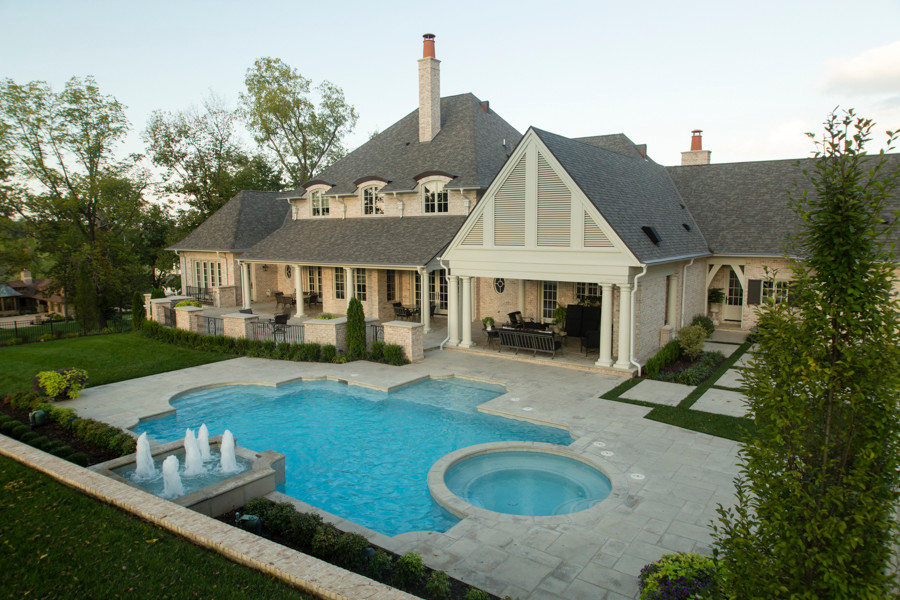 Inspiration for a mid-sized modern backyard custom-shaped pool in Other with a hot tub.